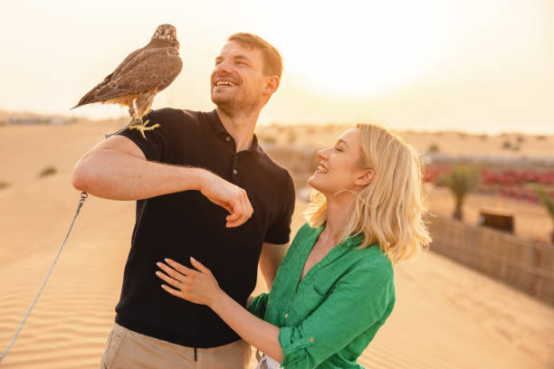 istock Young Man With A Falcon On His Shoulder In Dubai 1442260756