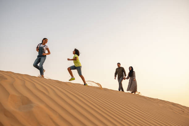 istock Children Playing On The Dune In Dubai 1442260827