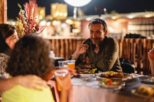 istock Middle Eastern Father Talking With The Family At Dinner In Dubai 1442260921