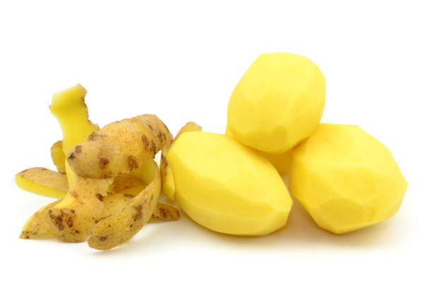 istock peeled potatoes and peelings 1442261077