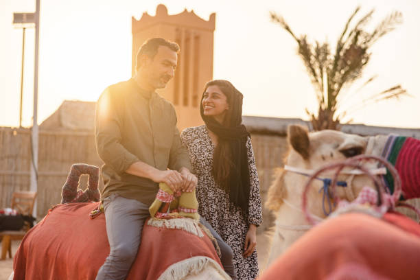 istock Happy Couple Before Camel Ride In Dubai 1442261125