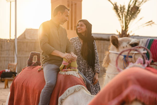 istock Married Couple Before Camel Ride In Dubai 1442261132
