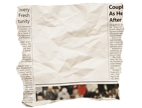 Crumpled, torn-out section of newspaper page with blank space for your copy