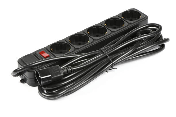 istock Black plastic electrical extension cord for household appliances isolated on white. 1442262874