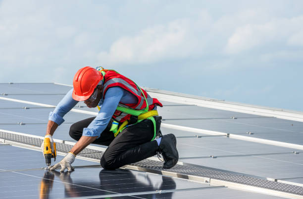 istock Engineer working setup Solar panel at the roof top. Engineer or worker work on solar panels or solar cells on the roof of business building 1442264725