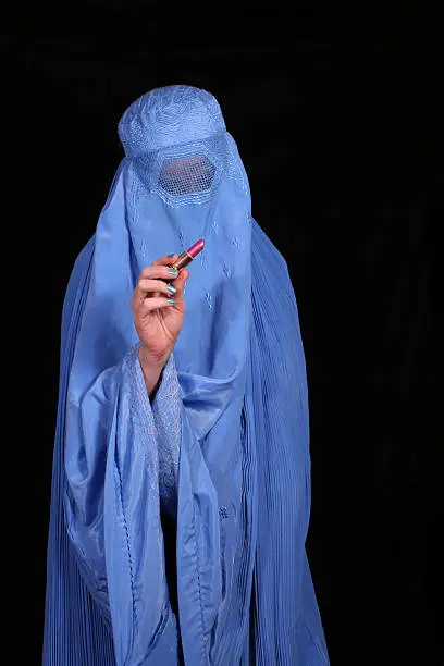 Woman From Afghanistan Holding Lipstick