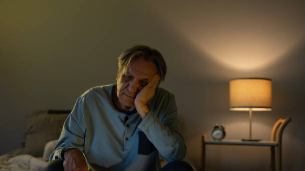 istock Old man can't sleep till late 1442271198