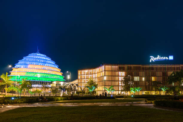 Kigali Convention Centre lit up in the colors of the Rwandan flag Kigali, Rwanda - August 19 2022: Kigali Convention Centre at night, lit up in the colors of the Rwandan flag. The facility is designed to host a variety of events and is a top attraction in the city. kigali convention center stock pictures, royalty-free photos & images