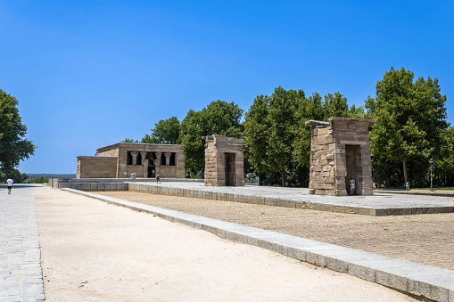 Madrid, Spain - July 12, 2022: Ancient Egyptian temple and museum moved from Aswan and rebuilt in lush parkland, with sunset views.