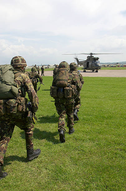 UK soldiers board puma helicopter British Army Exercise with helicopters dartmoor photos stock pictures, royalty-free photos & images