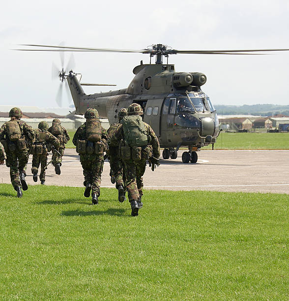 UK soldiers board puma helicopter