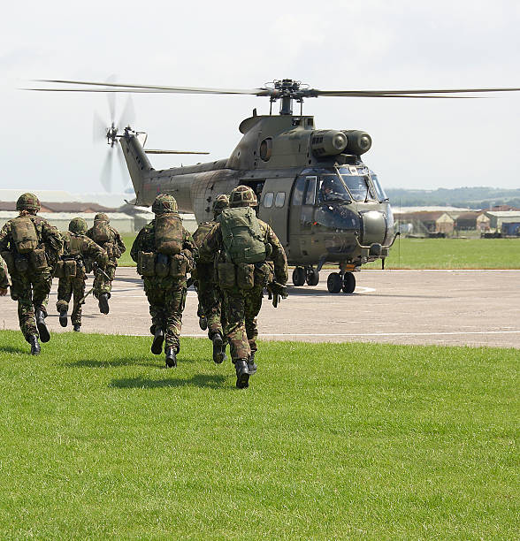 UK soldiers board puma helicopter British Army Exercise with helicopters army stock pictures, royalty-free photos & images