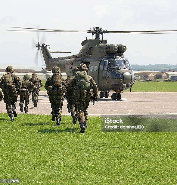 Uk Soldiers Board Puma Helicopter Stock Photo - Download Image Now - Army, UK, British Culture