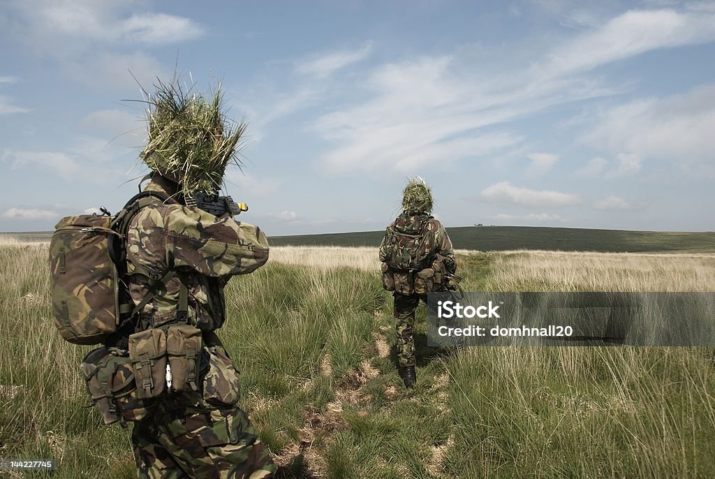 British troops watch as helicopter evacuates casualty British Army Exercise with helicopters UK Stock Photo