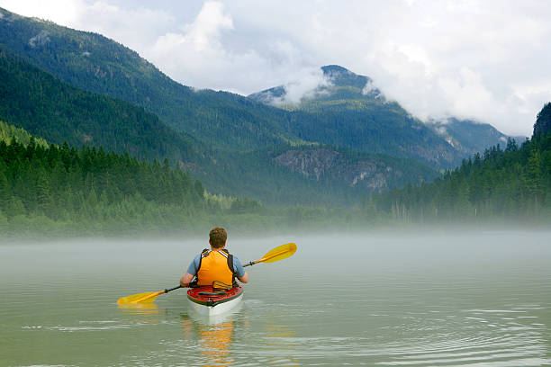 istock Kayaking in the river by the mountains 144227875