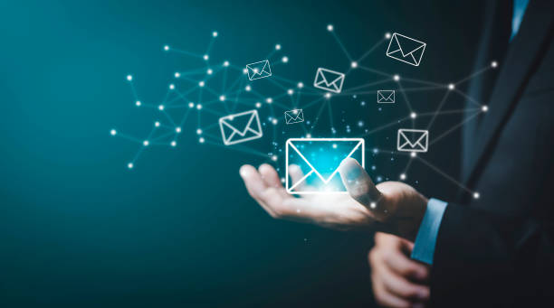 istock Businessman hand holding e-mail icon letter on a touch screen interface, virtual postal envelope, concept of spam email, internet and networking, Contact us newsletter email and protect your personal. 1442279524