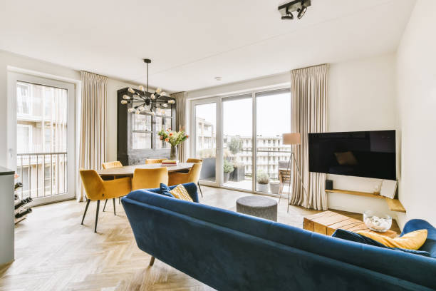 istock a living room with a blue couch and a tv 1442279691