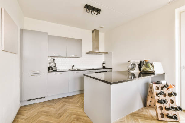 istock a kitchen with white cabinets and a black counter top 1442279716