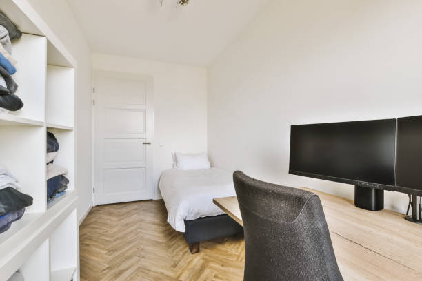 istock a bedroom with a bed and a tv 1442279753