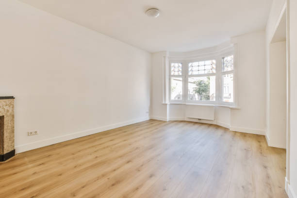 istock an empty living room with wood floors and a window 1442281379