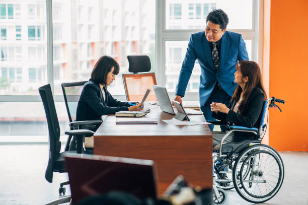 istock Mid adult CEO talking to his advisor team while giving them a presentation in the office 1442281421