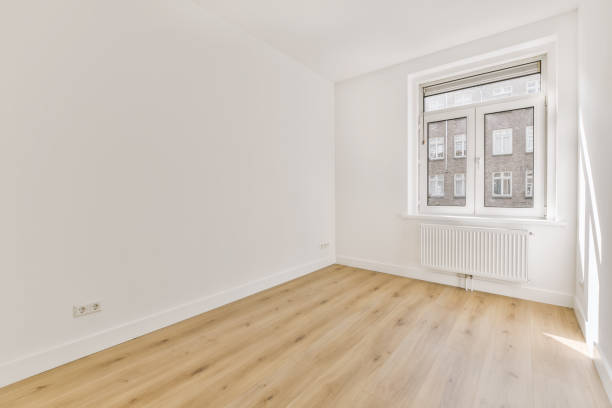 istock an empty room with wood floors and a window 1442281446