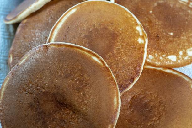 istock Pancakes with honey close-up on red plate. 1442283933