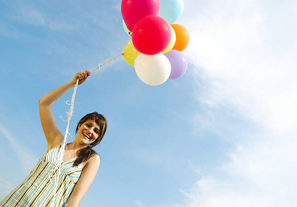 istock woman with balloons 144228489