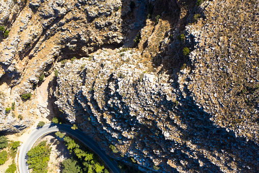 Aerial view of Jacobs Canyon near Attavyros mountain. Brown massive stones and rocks in mountain canyon. Located between Siana and Embona. Rhodes, Greece.