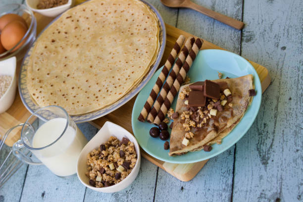 istock Chocolate pancakes with nuts and variations of chocolate 1442285213