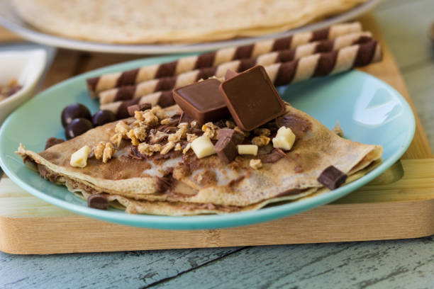 istock Chocolate pancakes with nuts and variations of chocolate 1442285238