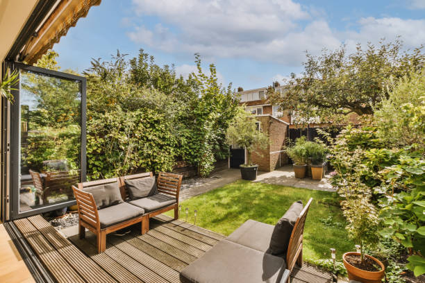 istock a backyard with a couch and chairs and a garden 1442287423
