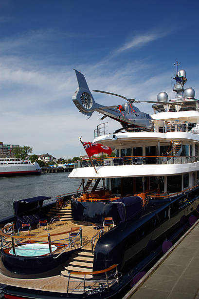 Exterior view of a luxury yacht with a hot tub and helipad stock photo