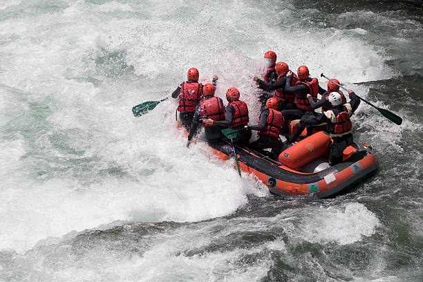 istock Group of people whitewater rafting 144228888