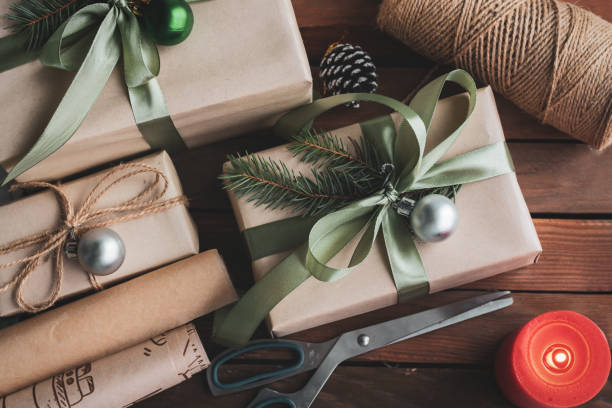 istock Flat lay composition with Christmas gift boxes and decor on wooden table 1442289063