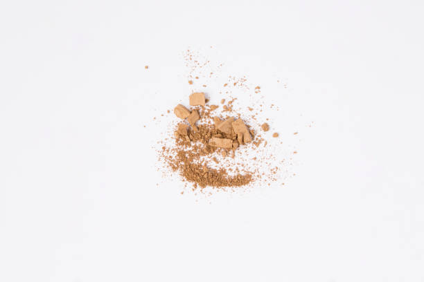 istock Beige face powder on the white background. Top view. Copy space. 1442290237