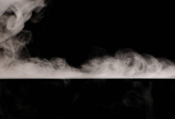istock Swirling white smoke on a black background 1442294945