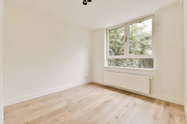 istock an empty room with wood floors and a window 1442295011