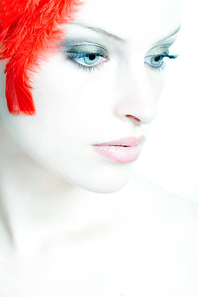 Woman with red feathers V stock photo