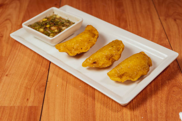 istock Colombian empanada with spicy sauce 1442296482