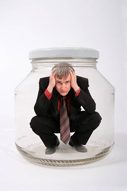 businessman in the jar stock photo