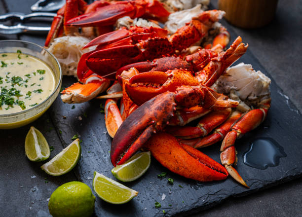 istock Lobster claws and Dungeness crab legs ready to eat 1442296843