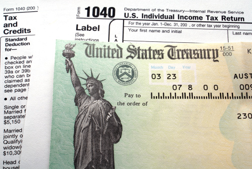 Tax return check on 1040 form background                    