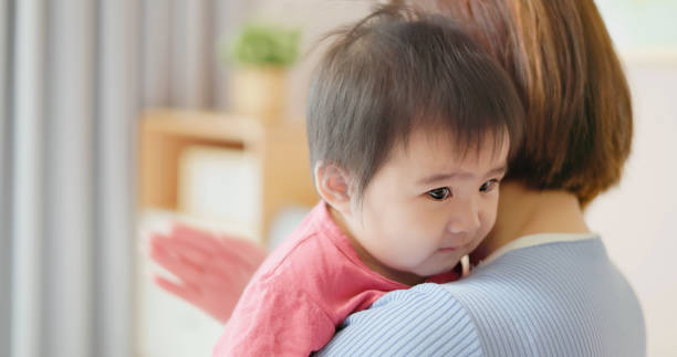 istock Mother holding baby 1442298238