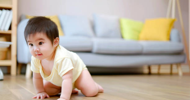 istock Baby crwaling on floor 1442299335