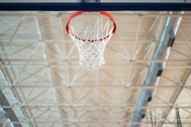 istock Basketball hoop in indoor gym. 1442299536