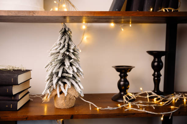 istock Beautiful decoration miniature christmas tree with garland 1442299560