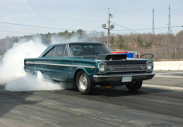 Sunday burn out Plymouth burn out at a drag racing track. car burnout stock pictures, royalty-free photos & images