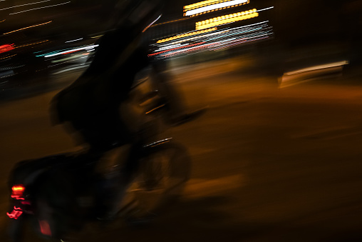 Cyclist riding at night in Toronto