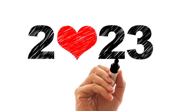 Handwriting 2023 text with heart shape stock photo